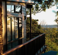 Rainforest Gardens - Luxury Hillside Chalets with Views to Bay  Islands - Accommodation Bookings