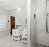 Bathers across the bay from Port Douglas - Accommodation Bookings